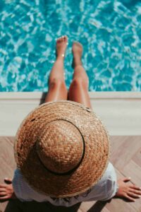 a woman sitting at the pool